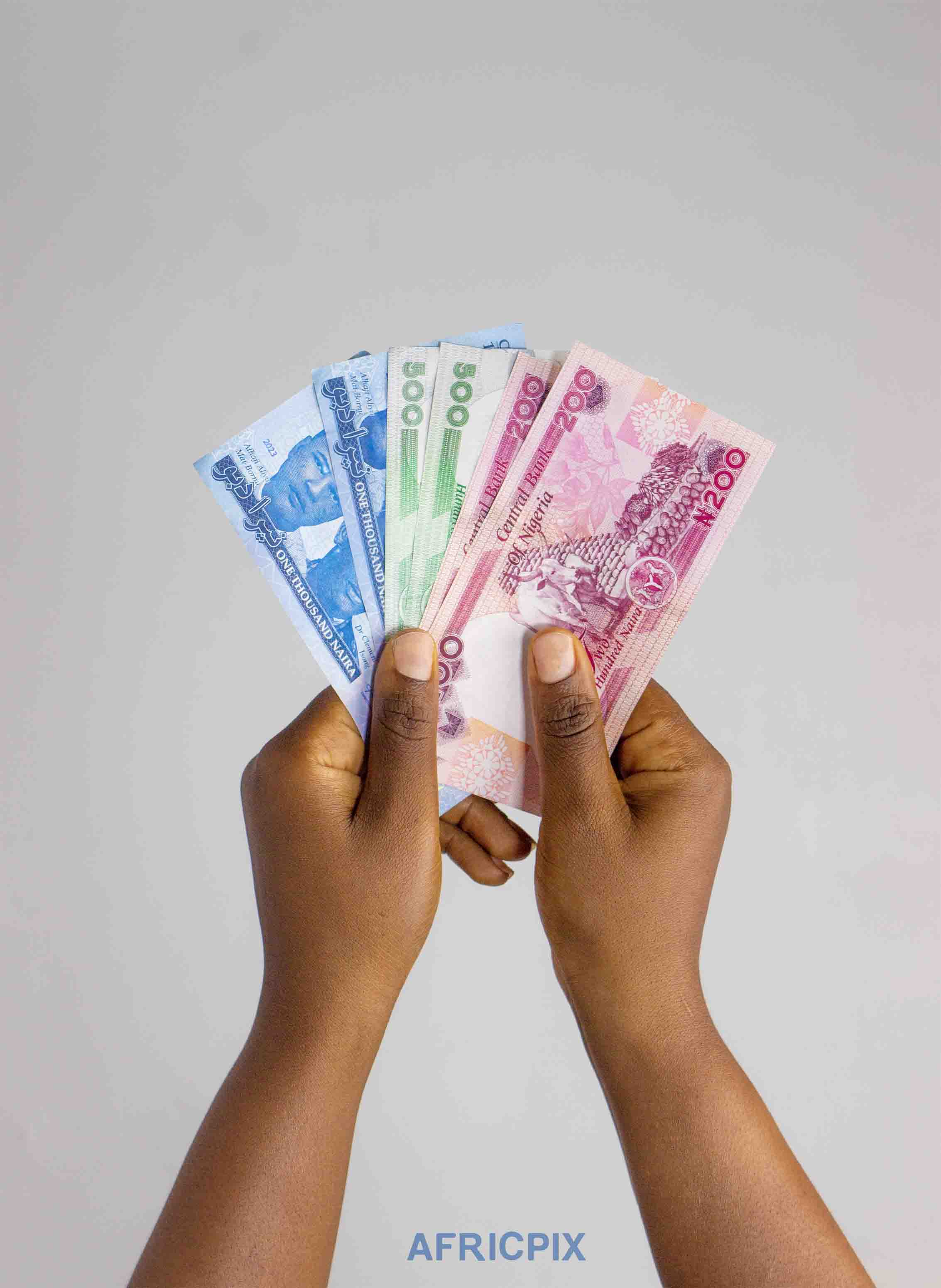 Hands Holding Naira Note